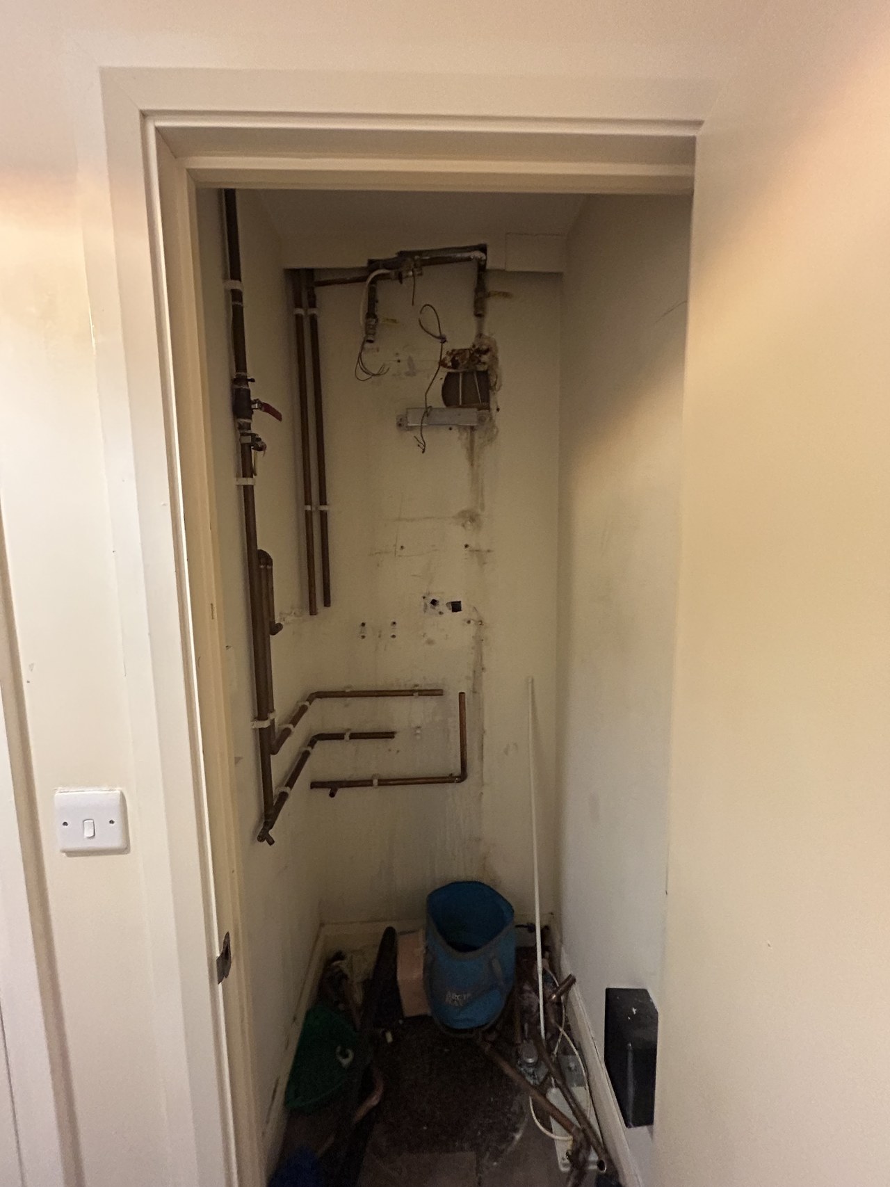 Cupboard stripped out before new pipework