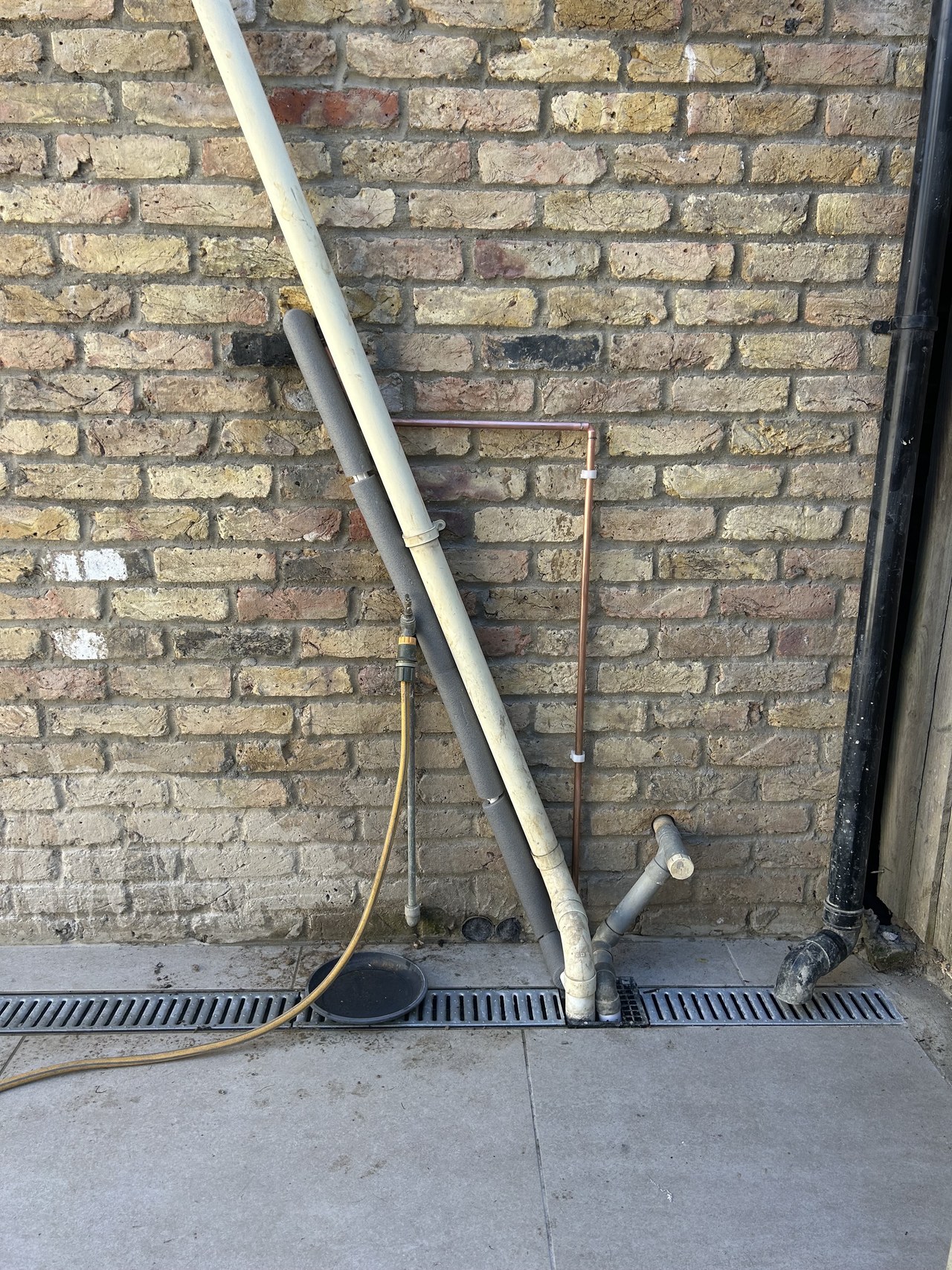 External pipe run into a drain