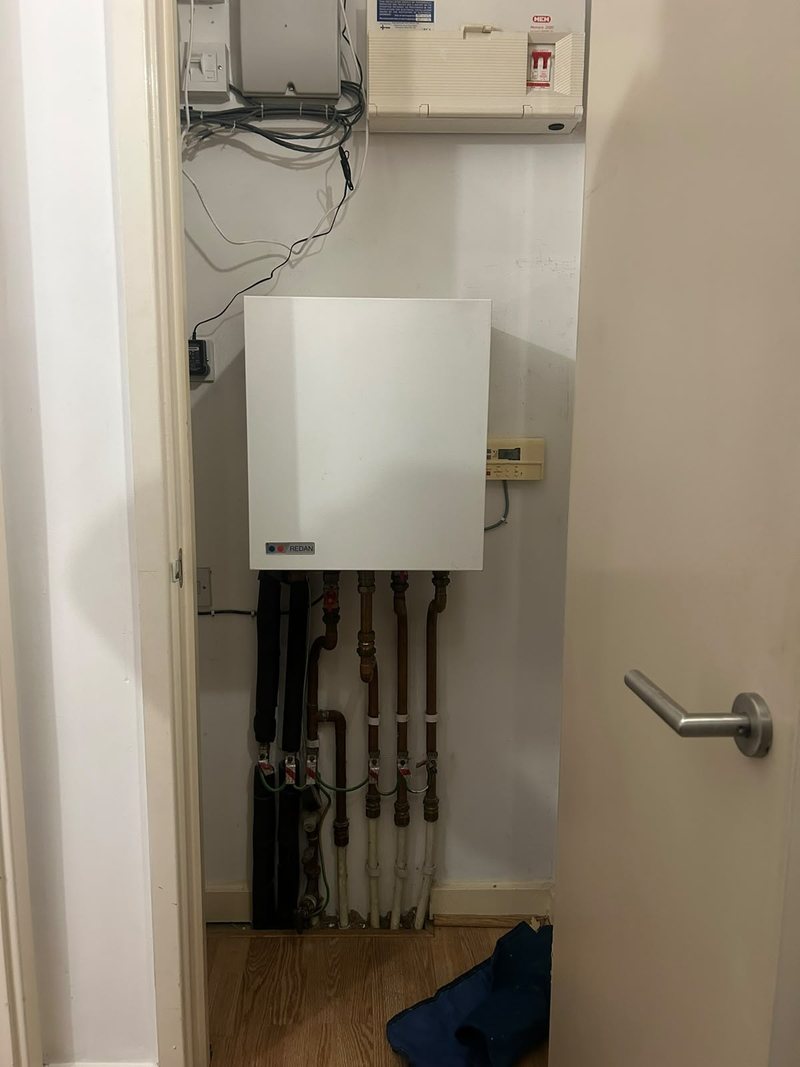 New heat interface unit fitted in a cupboard
