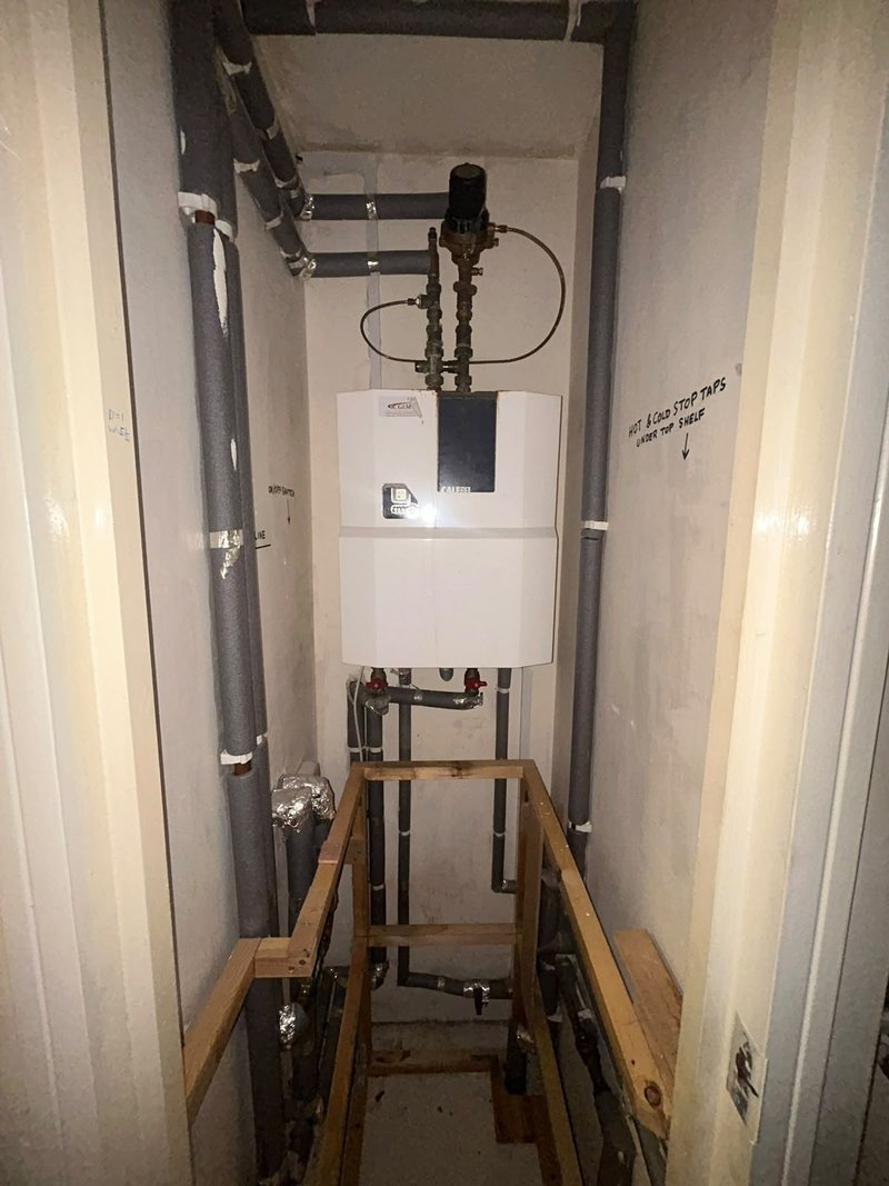 New heat interface unit fitted in a cupboard