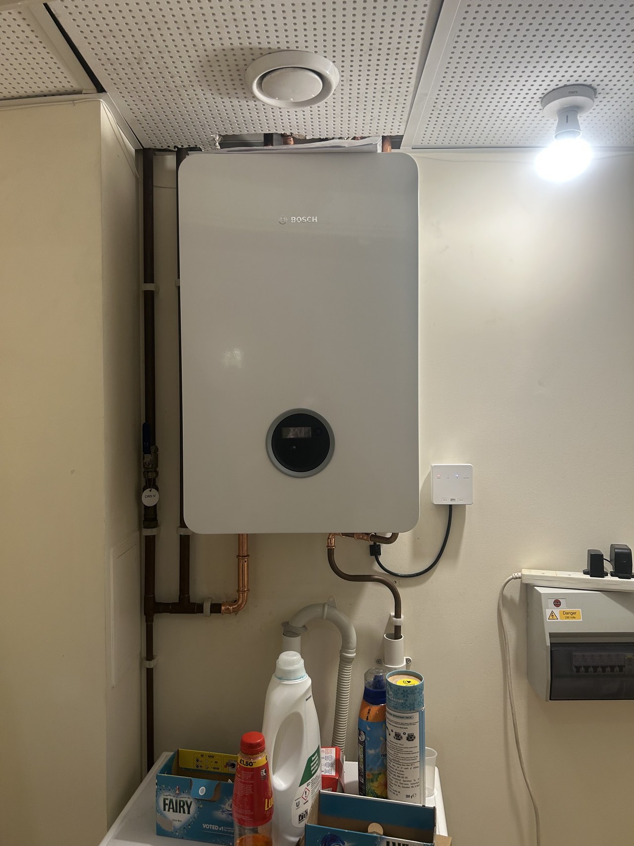 Wall-mounted heating unit in a utility room