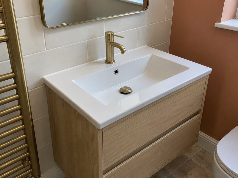 A mixer tap fitted on a basin with the flexible tails and isolation valves beneath